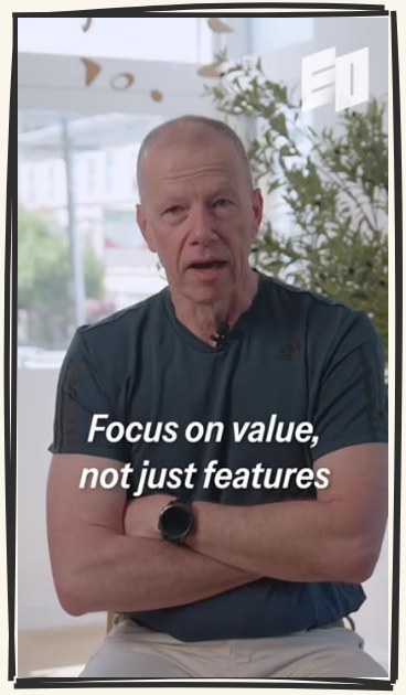 Opening frame two: a wide shot of the CEO, arms crossed, captioned Focus on value, not just features.