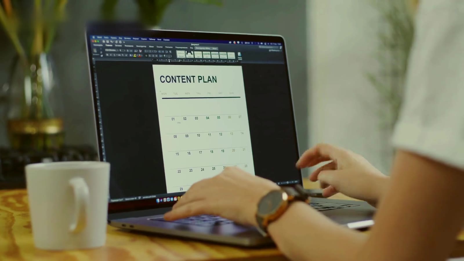 Hands typing a content plan
